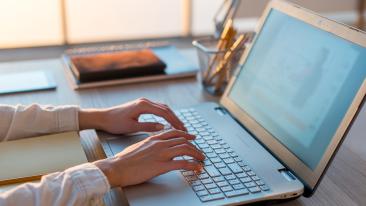 Jobs: the hands of a woman typing on a laptop