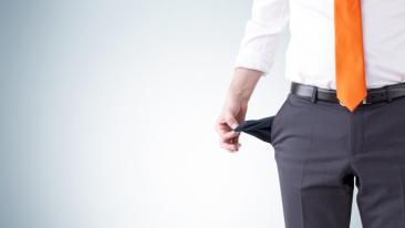 Fraudulent offers: a businessman shows his empty pocket